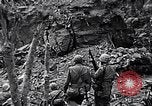 Image of US Marines look for remaining Japanese defenders Iwo Jima, 1945, second 8 stock footage video 65675026283