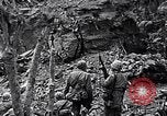 Image of US Marines look for remaining Japanese defenders Iwo Jima, 1945, second 9 stock footage video 65675026283