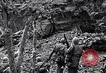 Image of US Marines look for remaining Japanese defenders Iwo Jima, 1945, second 10 stock footage video 65675026283