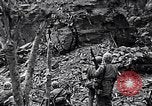 Image of US Marines look for remaining Japanese defenders Iwo Jima, 1945, second 11 stock footage video 65675026283