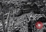 Image of US Marines look for remaining Japanese defenders Iwo Jima, 1945, second 15 stock footage video 65675026283
