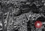 Image of US Marines look for remaining Japanese defenders Iwo Jima, 1945, second 16 stock footage video 65675026283