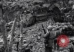 Image of US Marines look for remaining Japanese defenders Iwo Jima, 1945, second 17 stock footage video 65675026283