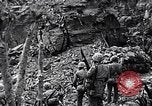 Image of US Marines look for remaining Japanese defenders Iwo Jima, 1945, second 21 stock footage video 65675026283