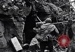 Image of US Marines look for remaining Japanese defenders Iwo Jima, 1945, second 57 stock footage video 65675026283