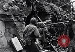 Image of US Marines look for remaining Japanese defenders Iwo Jima, 1945, second 60 stock footage video 65675026283