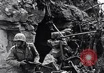 Image of US Marines look for remaining Japanese defenders Iwo Jima, 1945, second 62 stock footage video 65675026283