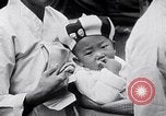 Immagine di Corea del Sud i cittadini votanti in 1950 Corea del Sud, 1950, secondo 60 filmato di repertorio 65675026523