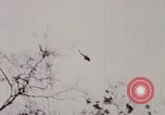 Image of U.S. Fighter bombers and Army helicopters in action during Operation J Vietnam, 1968, second 5 stock footage video 65675026532