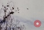 Image of U.S. Fighter bombers and Army helicopters in action during Operation J Vietnam, 1968, second 7 stock footage video 65675026532