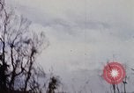 Image of U.S. Fighter bombers and Army helicopters in action during Operation J Vietnam, 1968, second 8 stock footage video 65675026532