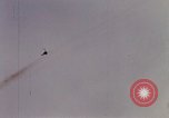 Image of U.S. Fighter bombers and Army helicopters in action during Operation J Vietnam, 1968, second 29 stock footage video 65675026532