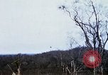 Image of U.S. Fighter bombers and Army helicopters in action during Operation J Vietnam, 1968, second 55 stock footage video 65675026532