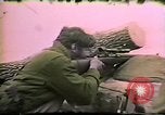 Image of Soldiers ready rifles during siege at wounded knee Wounded Knee South Dakota USA, 1973, second 42 stock footage video 65675026666