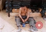 Image of Soldier cleaning his rifle during Operation Somerset Plain Vietnam, 1968, second 13 stock footage video 65675026843