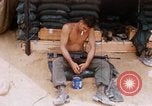 Image of Soldier cleaning his rifle during Operation Somerset Plain Vietnam, 1968, second 14 stock footage video 65675026843