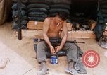 Image of Soldier cleaning his rifle during Operation Somerset Plain Vietnam, 1968, second 16 stock footage video 65675026843