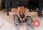Image of Soldier cleaning his rifle during Operation Somerset Plain Vietnam, 1968, second 17 stock footage video 65675026843