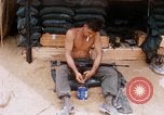 Image of Soldier cleaning his rifle during Operation Somerset Plain Vietnam, 1968, second 18 stock footage video 65675026843