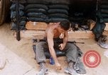 Image of Soldier cleaning his rifle during Operation Somerset Plain Vietnam, 1968, second 19 stock footage video 65675026843