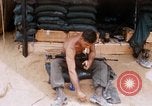Image of Soldier cleaning his rifle during Operation Somerset Plain Vietnam, 1968, second 20 stock footage video 65675026843