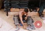 Image of Soldier cleaning his rifle during Operation Somerset Plain Vietnam, 1968, second 21 stock footage video 65675026843