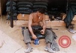 Image of Soldier cleaning his rifle during Operation Somerset Plain Vietnam, 1968, second 22 stock footage video 65675026843