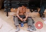Image of Soldier cleaning his rifle during Operation Somerset Plain Vietnam, 1968, second 23 stock footage video 65675026843