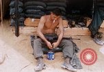 Image of Soldier cleaning his rifle during Operation Somerset Plain Vietnam, 1968, second 24 stock footage video 65675026843