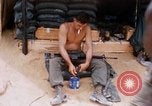 Image of Soldier cleaning his rifle during Operation Somerset Plain Vietnam, 1968, second 25 stock footage video 65675026843