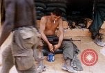 Image of Soldier cleaning his rifle during Operation Somerset Plain Vietnam, 1968, second 26 stock footage video 65675026843