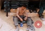 Image of Soldier cleaning his rifle during Operation Somerset Plain Vietnam, 1968, second 27 stock footage video 65675026843