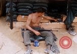 Image of Soldier cleaning his rifle during Operation Somerset Plain Vietnam, 1968, second 28 stock footage video 65675026843