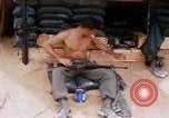 Image of Soldier cleaning his rifle during Operation Somerset Plain Vietnam, 1968, second 29 stock footage video 65675026843