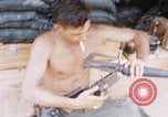 Image of Soldier cleaning his rifle during Operation Somerset Plain Vietnam, 1968, second 30 stock footage video 65675026843