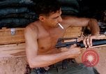 Image of Soldier cleaning his rifle during Operation Somerset Plain Vietnam, 1968, second 32 stock footage video 65675026843