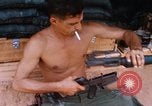 Image of Soldier cleaning his rifle during Operation Somerset Plain Vietnam, 1968, second 34 stock footage video 65675026843