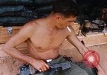 Image of Soldier cleaning his rifle during Operation Somerset Plain Vietnam, 1968, second 35 stock footage video 65675026843