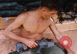 Image of Soldier cleaning his rifle during Operation Somerset Plain Vietnam, 1968, second 37 stock footage video 65675026843