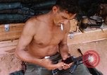 Image of Soldier cleaning his rifle during Operation Somerset Plain Vietnam, 1968, second 38 stock footage video 65675026843
