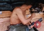 Image of Soldier cleaning his rifle during Operation Somerset Plain Vietnam, 1968, second 39 stock footage video 65675026843