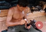Image of Soldier cleaning his rifle during Operation Somerset Plain Vietnam, 1968, second 41 stock footage video 65675026843