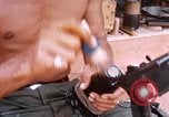 Image of Soldier cleaning his rifle during Operation Somerset Plain Vietnam, 1968, second 43 stock footage video 65675026843