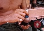Image of Soldier cleaning his rifle during Operation Somerset Plain Vietnam, 1968, second 44 stock footage video 65675026843