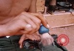 Image of Soldier cleaning his rifle during Operation Somerset Plain Vietnam, 1968, second 47 stock footage video 65675026843