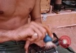 Image of Soldier cleaning his rifle during Operation Somerset Plain Vietnam, 1968, second 48 stock footage video 65675026843