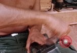 Image of Soldier cleaning his rifle during Operation Somerset Plain Vietnam, 1968, second 49 stock footage video 65675026843