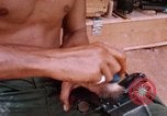 Image of Soldier cleaning his rifle during Operation Somerset Plain Vietnam, 1968, second 50 stock footage video 65675026843