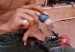 Image of Soldier cleaning his rifle during Operation Somerset Plain Vietnam, 1968, second 51 stock footage video 65675026843