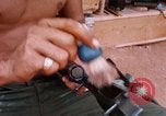 Image of Soldier cleaning his rifle during Operation Somerset Plain Vietnam, 1968, second 52 stock footage video 65675026843